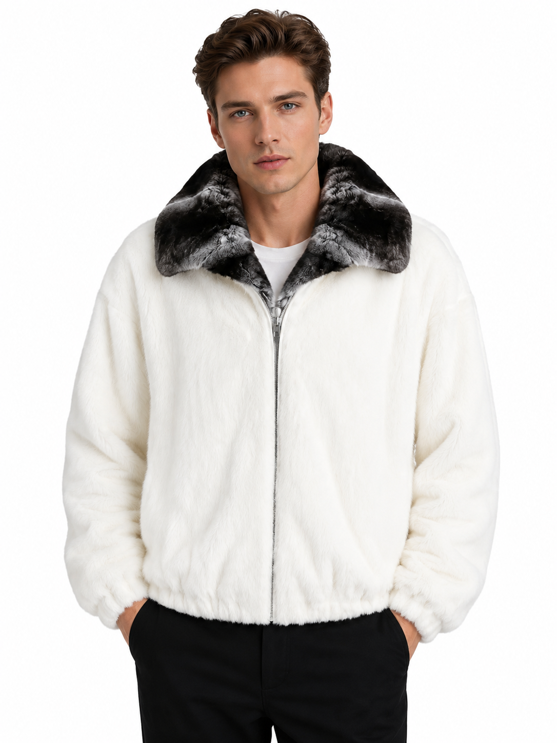 A man wearing a white faux fur zip-up jacket with a black and gray patterned faux fur collar, paired with black pants, against a plain white background.